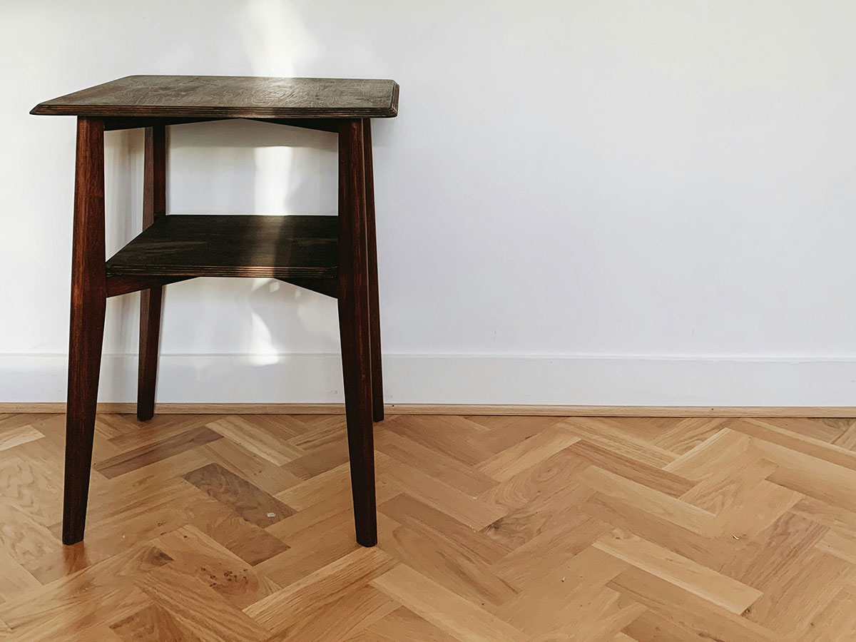 Example of a luxury parquet floor with a stool on it.