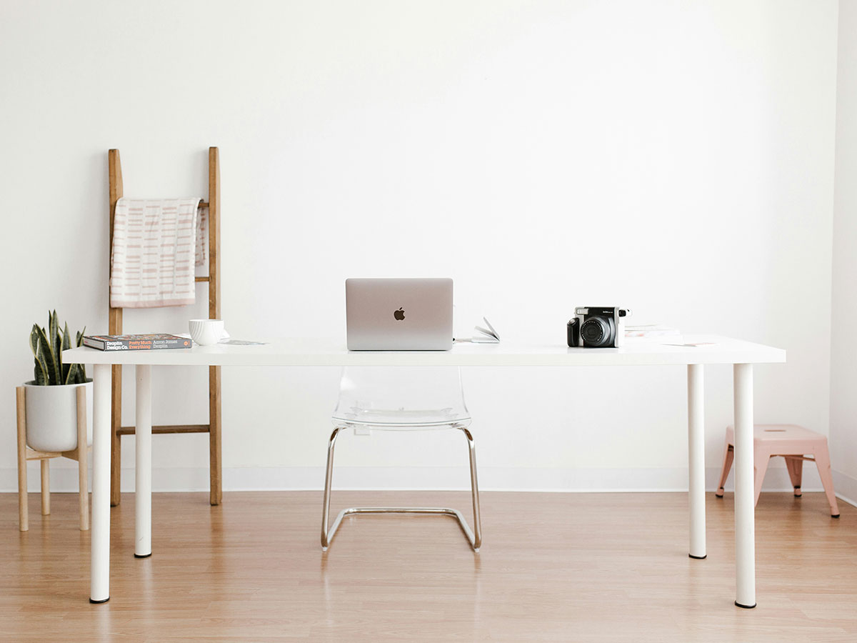 Example of a home office with a wooden floor.